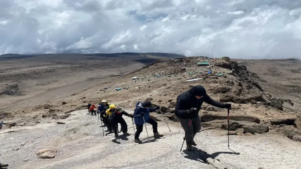 Hikers climbing Mount Kilimanjaro insurance