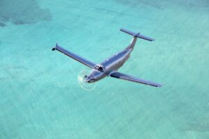 Tradewinds plane flying over water