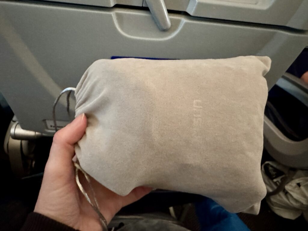 Sarisun 3D contoured blackout eye mask and compact travel pouch for long-haul flight sleep gear.